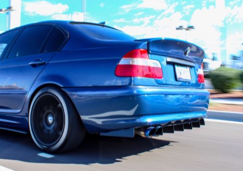 Close-up of aluminium rear diffuser on BMW E46 showing sharp fin design and precision mounting