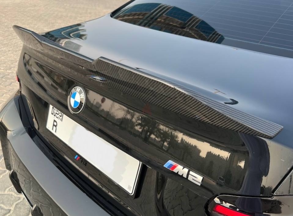Give your BMW M2 (G87) the ultimate edge. A sleek dry carbon fiber trunk spoiler delivers a bold aesthetic upgrade.