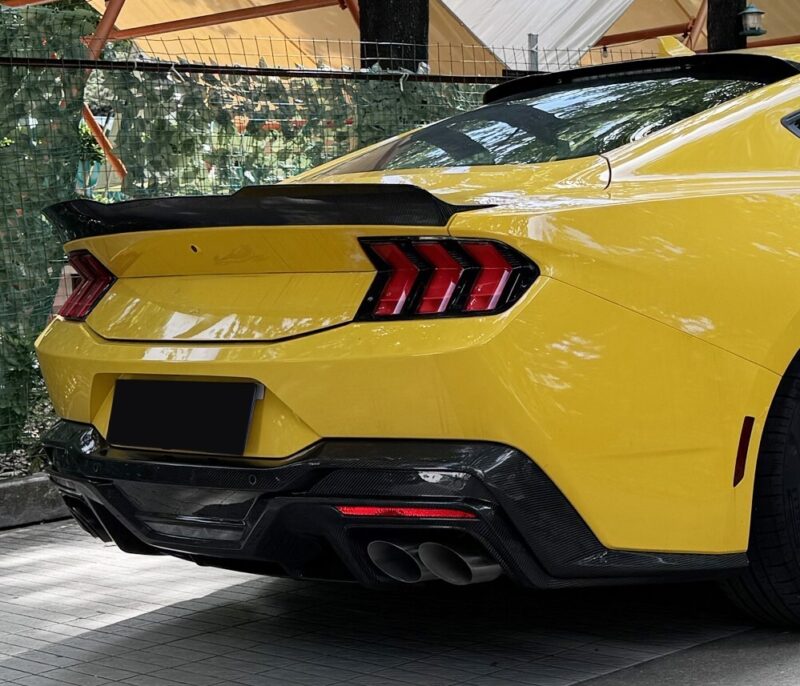 Detail shot of Ford Mustang S650 Dark Horse carbon rear spoiler boosting downforce and aggressive rear profile