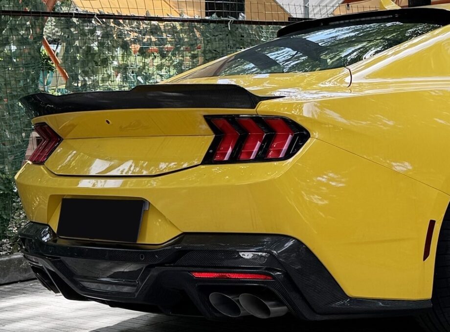 Detail shot of Ford Mustang S650 Dark Horse carbon rear spoiler boosting downforce and aggressive rear profile