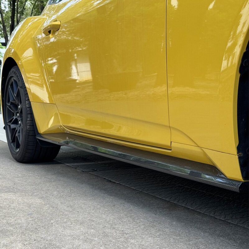 Detail view of Ford Mustang S650 carbon side skirts enhancing style and high-performance aerodynamics
